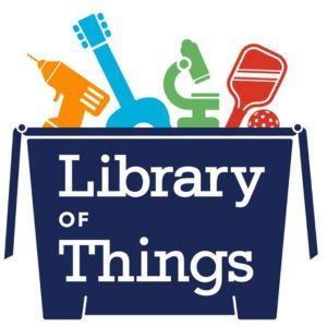 Box of things to borrow from the Library of Things including a drill, a guitar, a microscope, and a game paddle