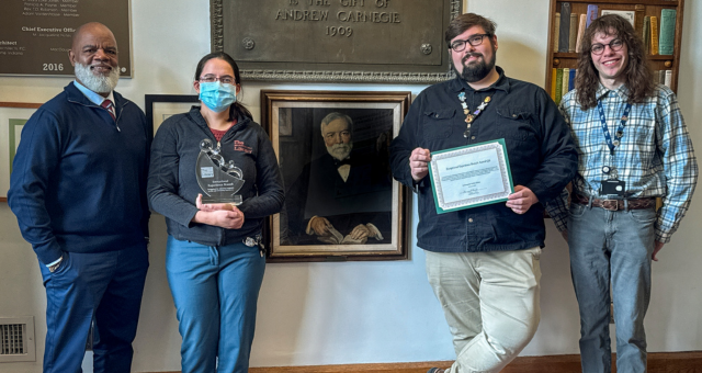 CEO Gregory Hill with the staff of East Washington Branch, who received an Exceptional Experiences Branch Award for Q4 2025.