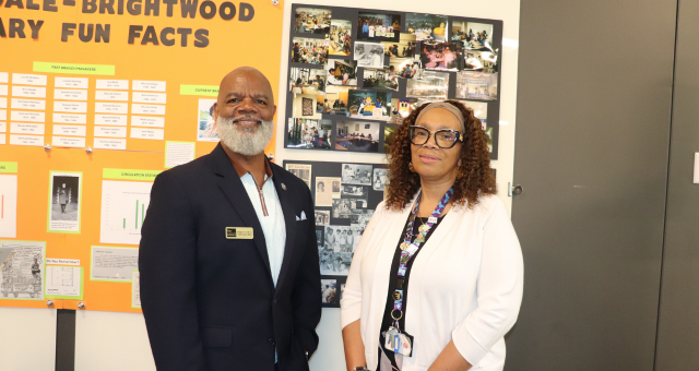 CEO Gregory A. Hill, Sr., with Martindale-Brightwood Manager Theresa Coleman