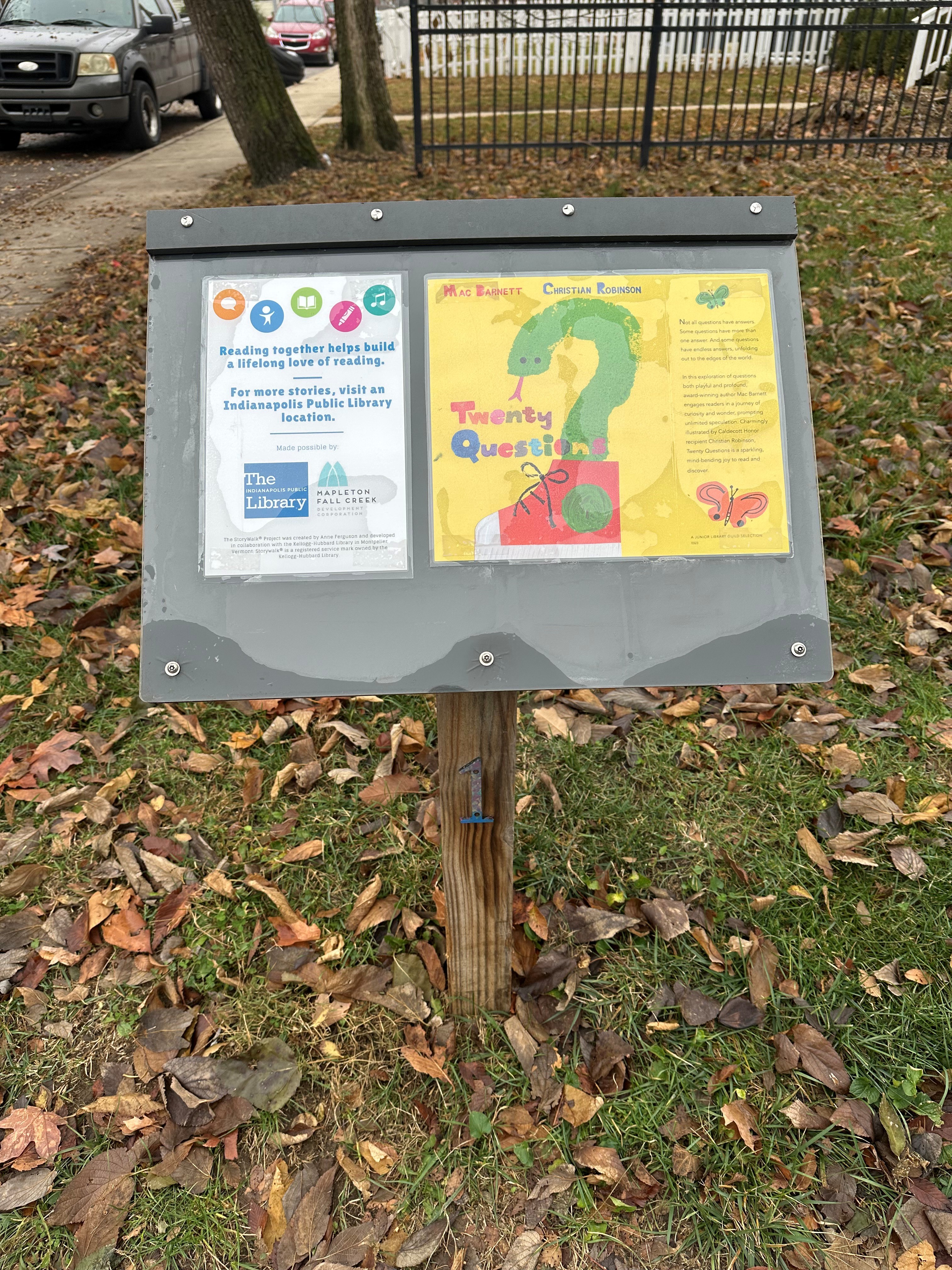 The story Twenty Questions by Mac Barnett and Christian Robinson mounted on a frame for outdoor reading.