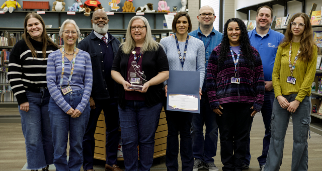 CEO Gregory Hill with the staff of Southport Branch, who received the Systemwide Exceptional Experiences Branch Award for Q3 2025.