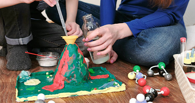 Children making a model of a volcano.