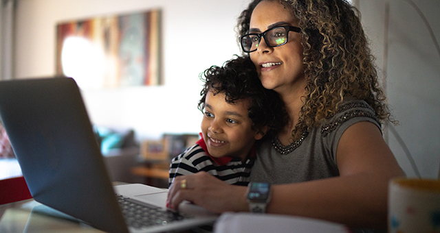 parent and child enjoying an online activity together