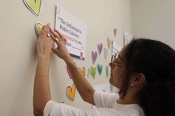 Hallie Raikes, the manager of the Indianapolis Public Library’s Center for Black Literature and Culture, sharing a comment on the contribution wall.