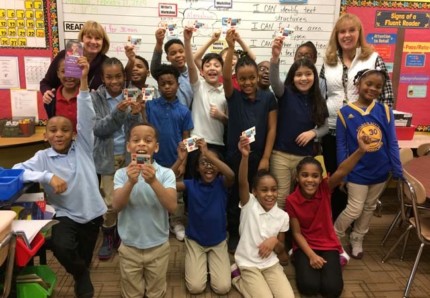 Third graders in the classroom of Cheryl Godsey at New Augusta Academy South elementary school show off their new Indianapolis Public Library cards at a February 11 celebration event. They are among the 10,341 elementary and secondary students in MSD Pike Township who now have free access to the Library’s online and physical resources.